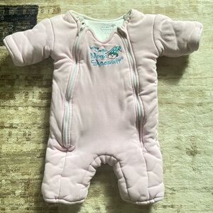 Baby Merlin light pink sleep suit.